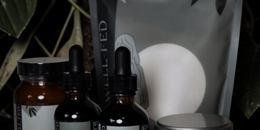 Collection of natural health products with labels on a dark background