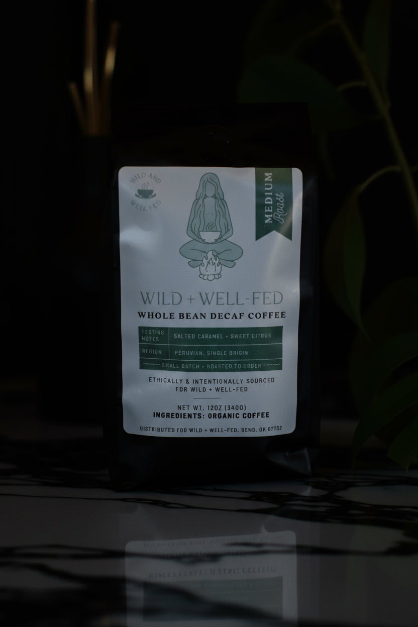 Coffee package labeled 'Wild + Well Fed' on a dark background