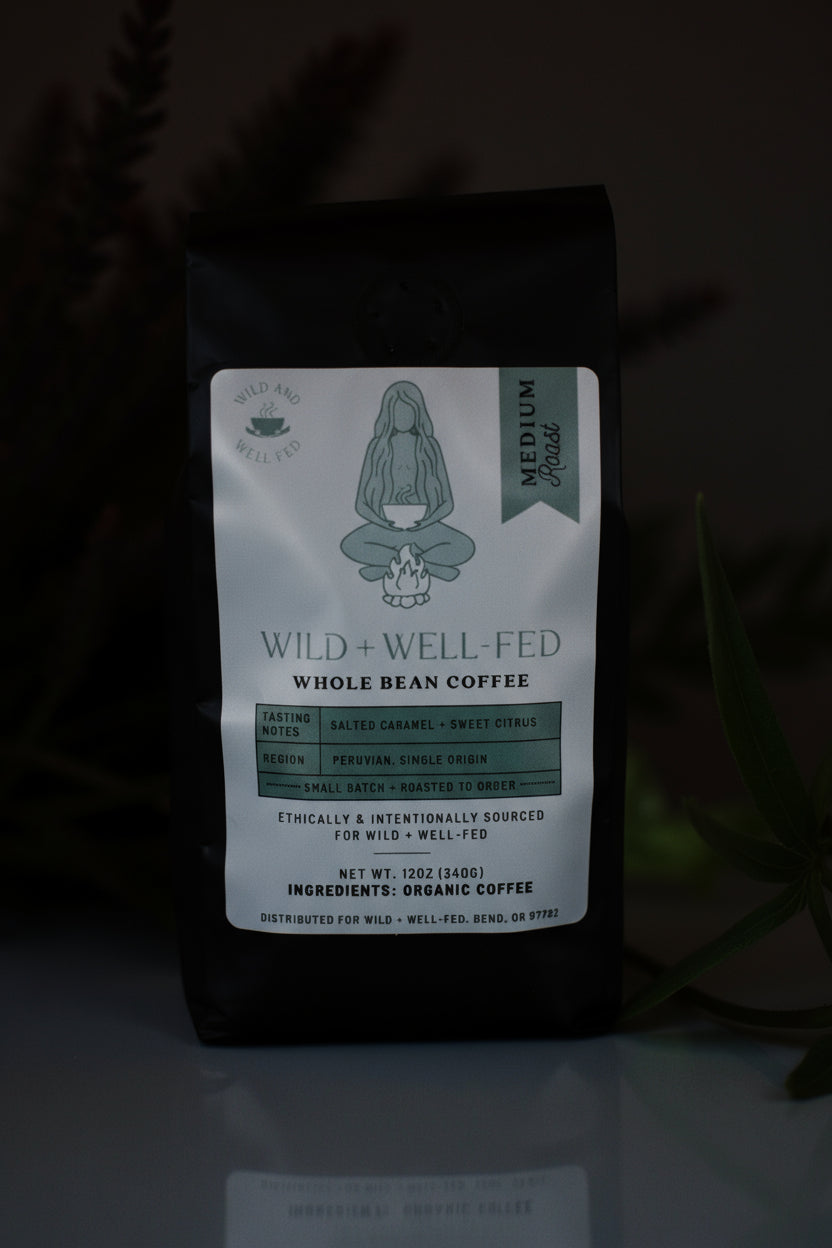Coffee bag with 'Wild + Well Fed' label on a dark background