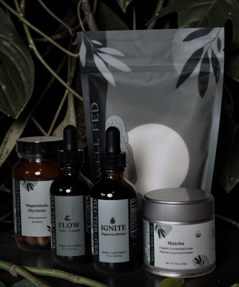 Collection of natural health products with labels on a dark background