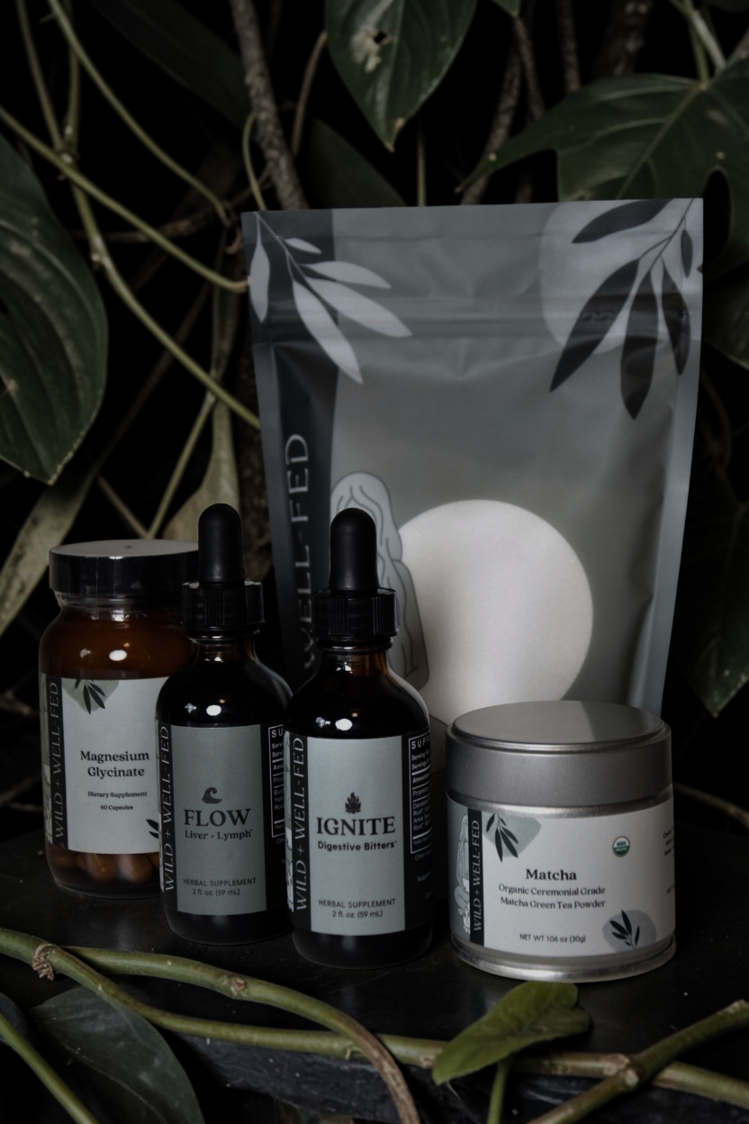 Collection of natural health products with labels on a dark background