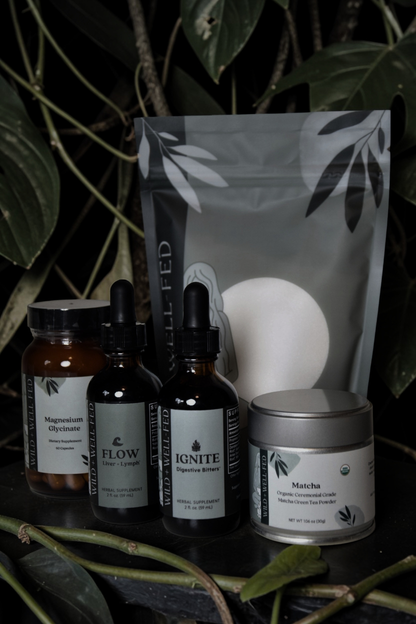 Collection of natural health products with labels on a dark background
